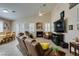 Comfortable living room with high ceilings, neutral tones, a fireplace, and media center at 2543 Farmington Ave, Las Vegas, NV 89120