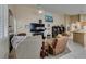 Open-concept living area with cozy seating, a fireplace, and natural light at 2543 Farmington Ave, Las Vegas, NV 89120