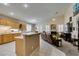 Open-concept living area with a breakfast bar, fireplace, and comfortable seating at 2543 Farmington Ave, Las Vegas, NV 89120