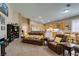 Open-concept living room with generous seating and seamless access to the kitchen and dining area at 2543 Farmington Ave, Las Vegas, NV 89120