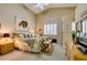 Cozy main bedroom featuring a king-sized bed, neutral walls, and plush carpeting at 2543 Farmington Ave, Las Vegas, NV 89120