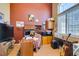 Cozy home office with dark red walls, a wooden desk, and ample storage at 2543 Farmington Ave, Las Vegas, NV 89120
