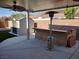 Well-maintained backyard with a stylish storage shed and manicured artificial grass at 2543 Farmington Ave, Las Vegas, NV 89120