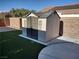 Backyard storage shed featuring stylish design elements and a neutral color palette at 2543 Farmington Ave, Las Vegas, NV 89120