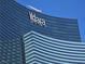 Exterior shot of Vdara Hotel & Spa featuring the Vdara logo against a clear blue sky at 2600 W Harmon Ave # 20034, Las Vegas, NV 89158