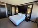 Serene bedroom featuring a luxurious bed, ambient lighting, and a view into the bathroom at 2600 W Harmon Ave # 20034, Las Vegas, NV 89158