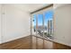 Bedroom with hardwood floors and a large window overlooking the city skyline at 2777 Paradise Rd # 2605, Las Vegas, NV 89109
