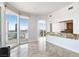 Open concept living room boasts natural light and panoramic city views with light stone flooring at 2777 Paradise Rd # 2605, Las Vegas, NV 89109