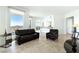 Modern living room filled with natural light from the large windows features stylish tile flooring at 2777 Paradise Rd # 2605, Las Vegas, NV 89109