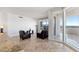 Light filled living room featuring tile floors, modern furniture and access to an outdoor terrace at 2777 Paradise Rd # 2605, Las Vegas, NV 89109