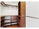 Walk-in closet with wooden shelves and drawers for optimal organization at 2777 Paradise Rd # 2605, Las Vegas, NV 89109