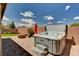 Serene backyard featuring a hot tub, fire pit, and lush landscaping, perfect for outdoor relaxation and entertainment at 2902 Ventana Ridge Ave, Henderson, NV 89044