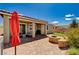 Spacious backyard with a covered patio, outdoor grill, and inviting fire pit, ideal for year-round enjoyment at 2902 Ventana Ridge Ave, Henderson, NV 89044