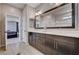 The bathroom features a dual sink, modern vanity, and an adjacent door to the bedroom at 2902 Ventana Ridge Ave, Henderson, NV 89044