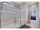 This is a walk-in shower with white tiles and a glass door at 2902 Ventana Ridge Ave, Henderson, NV 89044