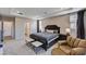 This is a bedroom that features a large bed and a chair at 2902 Ventana Ridge Ave, Henderson, NV 89044