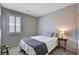 A bedroom with gray walls and carpeted floors and a small window at 2902 Ventana Ridge Ave, Henderson, NV 89044