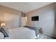 Cozy bedroom features neutral walls, carpet floors, television and a closet for ample storage space at 2902 Ventana Ridge Ave, Henderson, NV 89044