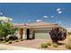 Attractive single-story home with a tile roof, two car garage and lush landscaping at 2902 Ventana Ridge Ave, Henderson, NV 89044