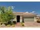 Inviting single-story home with landscaped front yard and a two car garage at 2902 Ventana Ridge Ave, Henderson, NV 89044