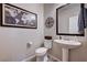 Half bathroom features tile floors, toilet and a sink at 2902 Ventana Ridge Ave, Henderson, NV 89044