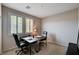 Home office features carpet floors, a desk and an abundance of natural light at 2902 Ventana Ridge Ave, Henderson, NV 89044