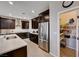 Well-equipped kitchen features dark wood cabinets, stainless steel appliances, and a walk-in pantry at 2902 Ventana Ridge Ave, Henderson, NV 89044
