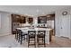 Modern kitchen boasts granite countertops, stainless steel appliances, and a large center island with seating at 2902 Ventana Ridge Ave, Henderson, NV 89044