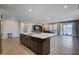 Open floor plan showcasing an expansive kitchen island, stainless steel appliances, and modern finishes at 2902 Ventana Ridge Ave, Henderson, NV 89044