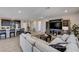 Spacious open-concept living area with kitchen island, comfortable seating, and modern decor at 2902 Ventana Ridge Ave, Henderson, NV 89044