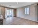Spacious living room features wood floors, neutral walls, and sliding glass door to outdoor patio at 2902 Ventana Ridge Ave, Henderson, NV 89044