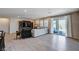 Bright living room with wood floors, modern furniture, and sliding glass doors to outdoor space at 2902 Ventana Ridge Ave, Henderson, NV 89044