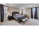 Main bedroom boasts neutral colors, tray ceiling, plush carpet, and elegant furniture at 2902 Ventana Ridge Ave, Henderson, NV 89044