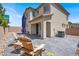 Charming backyard with a patio, seating, and well-maintained landscaping at 3002 Coveri Ct, Las Vegas, NV 89141