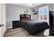 Simple bedroom with dark furnishings, complemented by modern decor and ample natural light at 3002 Coveri Ct, Las Vegas, NV 89141