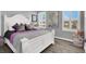 Bright bedroom with white furniture, two windows with shutters, and modern decor at 3002 Coveri Ct, Las Vegas, NV 89141