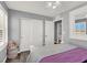 Cozy bedroom with white trim, neutral walls, and a ceiling fan for added comfort at 3002 Coveri Ct, Las Vegas, NV 89141