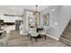 Elegant dining area with a stylish chandelier and views of the modern kitchen at 3002 Coveri Ct, Las Vegas, NV 89141