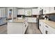 Spacious kitchen with a large island, stainless steel appliances, and white cabinetry at 3002 Coveri Ct, Las Vegas, NV 89141