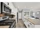 Bright, open-concept kitchen with a large island, modern appliances, and stylish backsplash at 3002 Coveri Ct, Las Vegas, NV 89141