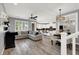 Open-concept living room with modern furnishings and an adjacent dining area at 3002 Coveri Ct, Las Vegas, NV 89141