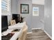 Functional home office space with a desk, computer, and natural light at 3002 Coveri Ct, Las Vegas, NV 89141
