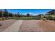 Green neighborhood park with gravel walking path and picnic table at 3002 Coveri Ct, Las Vegas, NV 89141