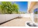 This backyard features low-maintenance landscaping, new privacy fence and neutral paint at 3041 Gary Cooper St # 103, Las Vegas, NV 89122