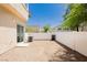 A low maintenance backyard with gravel, and a privacy fence surrounding the property at 3041 Gary Cooper St # 103, Las Vegas, NV 89122