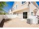A low maintenance backyard with gravel, a patio and a privacy fence surrounding the property at 3041 Gary Cooper St # 103, Las Vegas, NV 89122