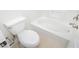Clean, white bathroom features a modern toilet and a bathtub with tiled walls and chrome fixtures at 3041 Gary Cooper St # 103, Las Vegas, NV 89122