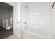 This bathroom features white tiling in the shower and tub area, and a chrome shower head at 3041 Gary Cooper St # 103, Las Vegas, NV 89122