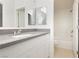 Updated bathroom features a vanity with gray countertop, modern fixtures, and shower/tub combo at 3041 Gary Cooper St # 103, Las Vegas, NV 89122
