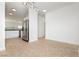 Dining area open to the kitchen, featuring modern lighting at 3041 Gary Cooper St # 103, Las Vegas, NV 89122